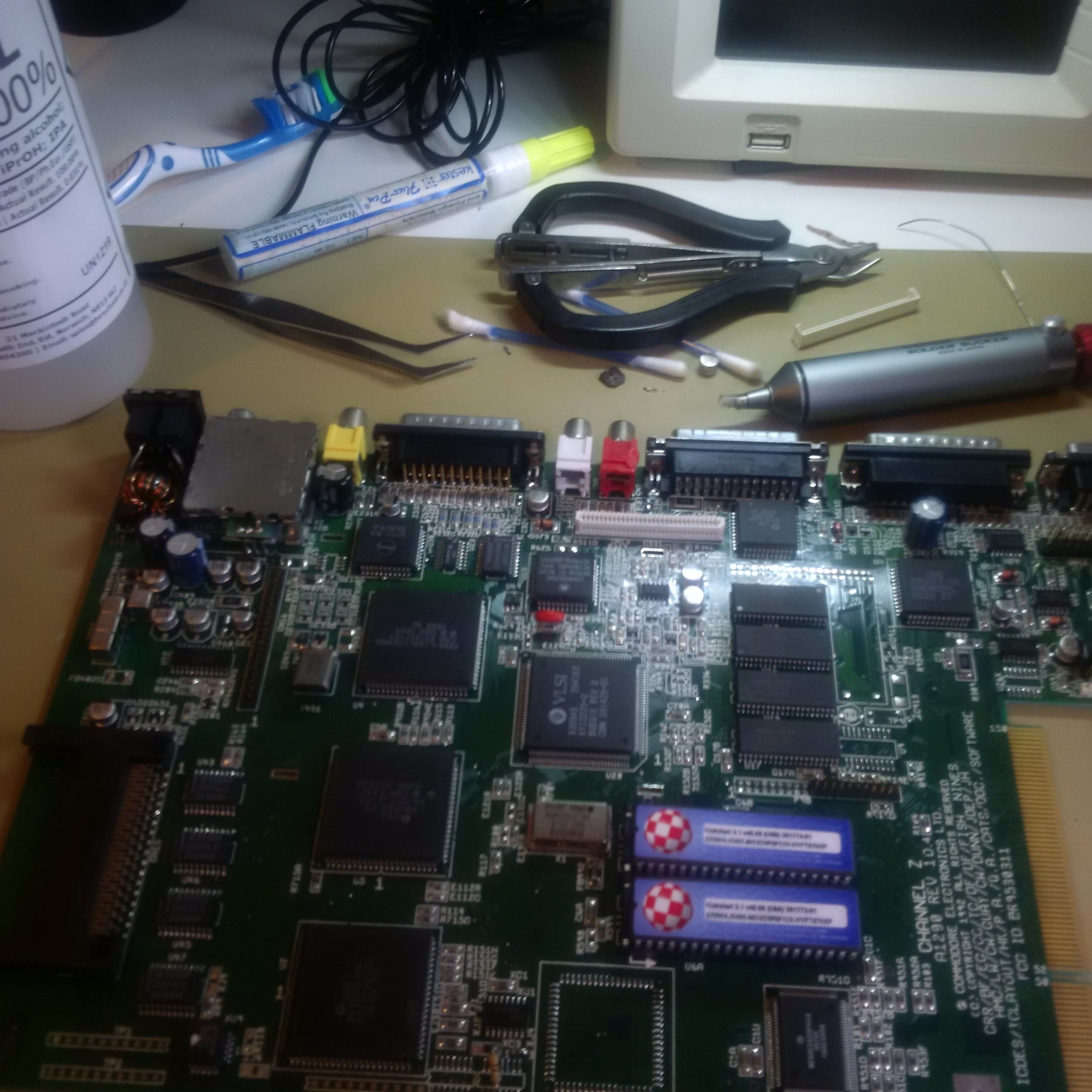 amiga_circuit_board_with_solder_sucker.jpg